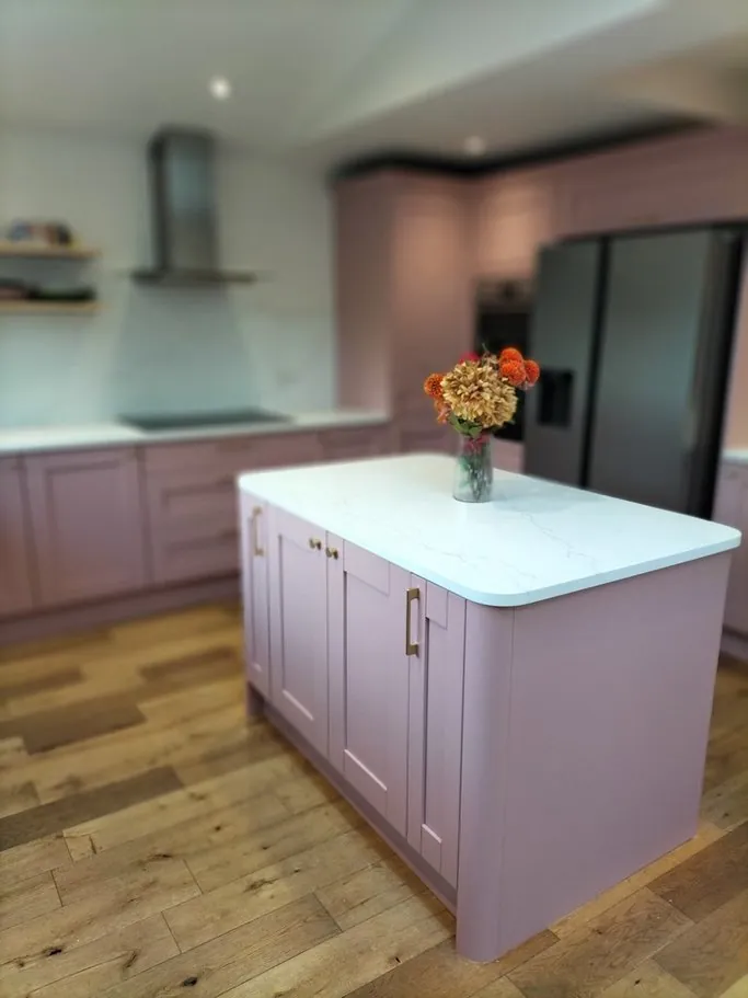 Kitchen in Bishops Waltham SO32, Hampshire resprayed dusky pink with brass handles by Kitchen Decorators