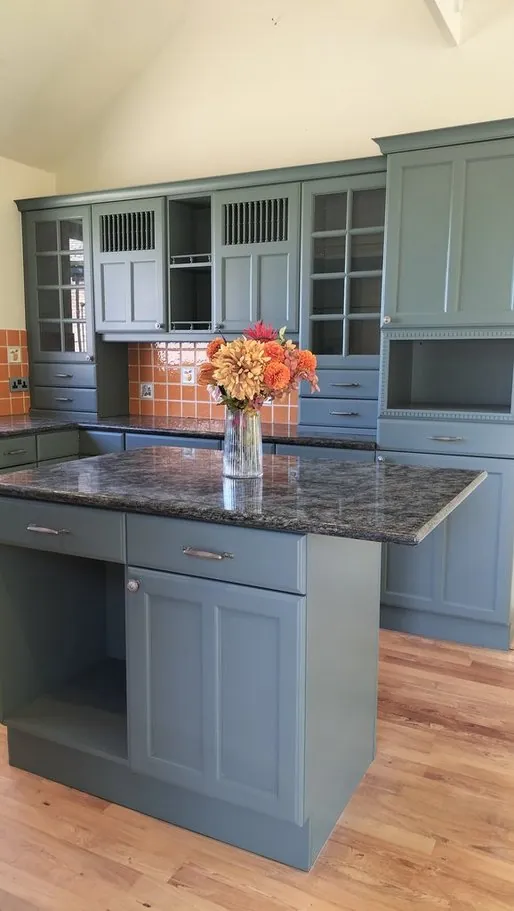 Kitchen in Botley SO30, Hampshire resprayed teal green with a granite island by Kitchen Decorators