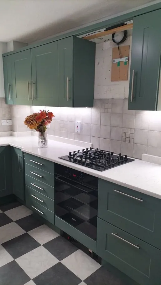 Kitchen in Denmead PO7, Hampshire resprayed deep green by Kitchen Decorators