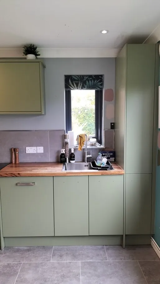 Kitchen in Hursley SO21, Hampshire resprayed sage green by Kitchen Decorators