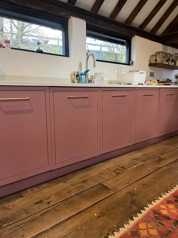 Kitchen in Waterlooville PO7, Hampshire resprayed dusky pink with brass handles by Kitchen Decorators